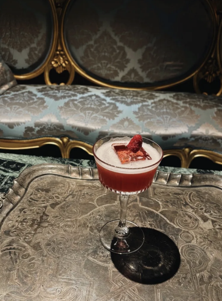 Cocktail on silver tray in front of Napoleon damask sofa, Gourmet & Glouton Chaudes-Aigues