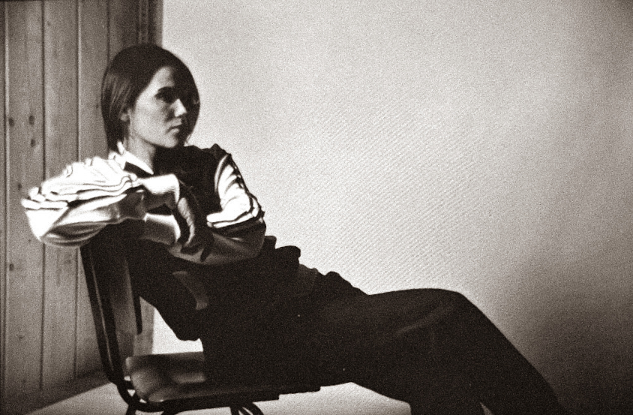 Portrait of tattoo artist Tamara Chaudesaigues in a minimalist black and white editorial photograph