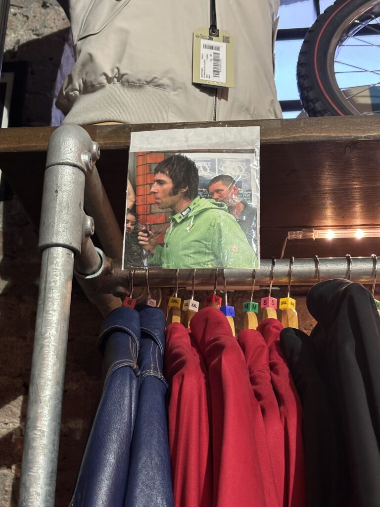 Photo of Liam Gallagher pinned on a clothing rail at Modfather Camden London