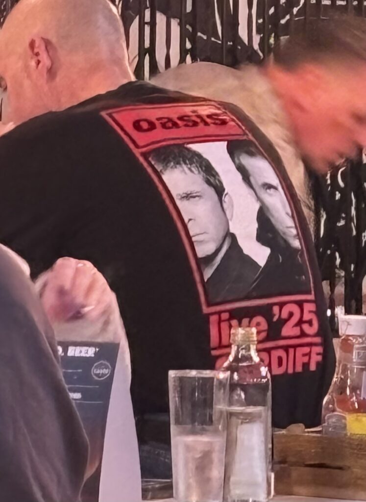 Oasis Live 25 Cardiff tour t-shirt spotted in London, Oasis 2025 tour