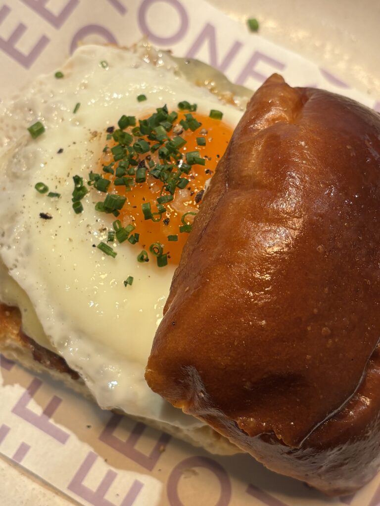 Breakfast bun with fried egg and chives at Ozone Shoreditch London