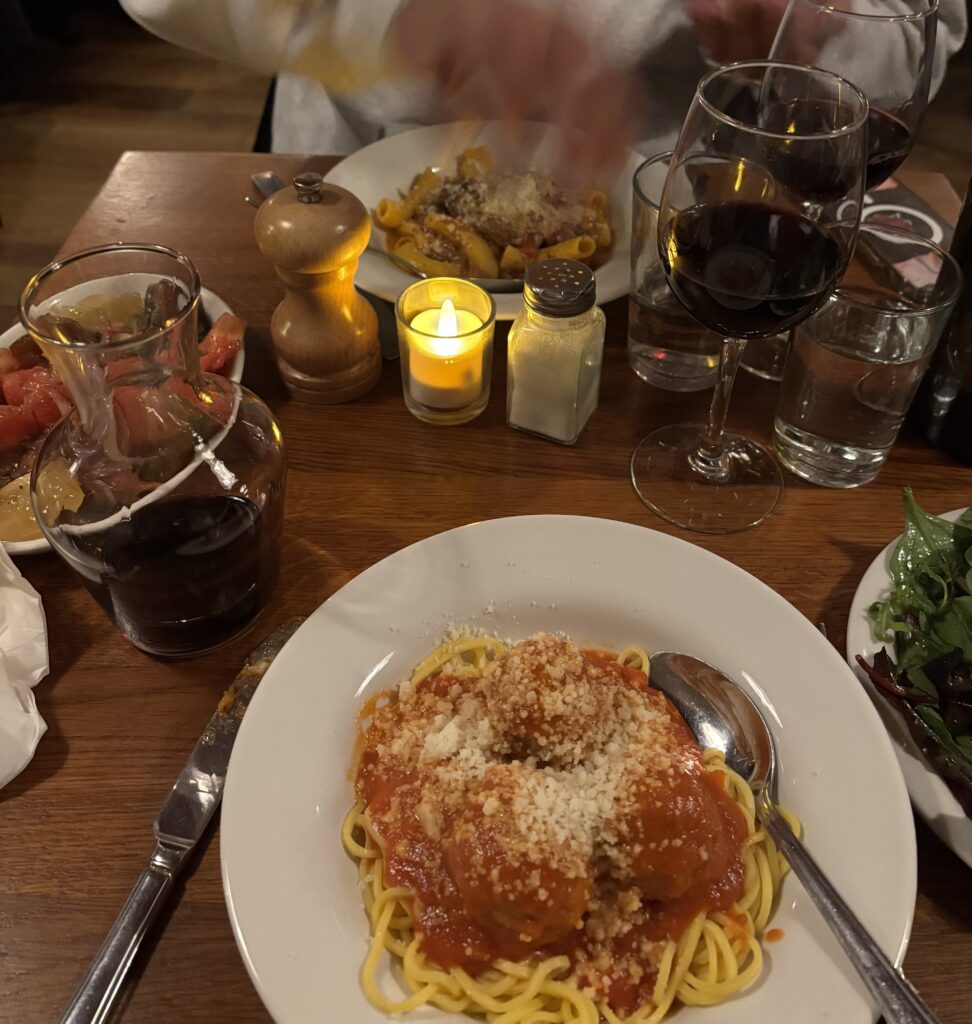 Spaghetti meatballs and carafe of red wine at Polpo restaurant Soho London