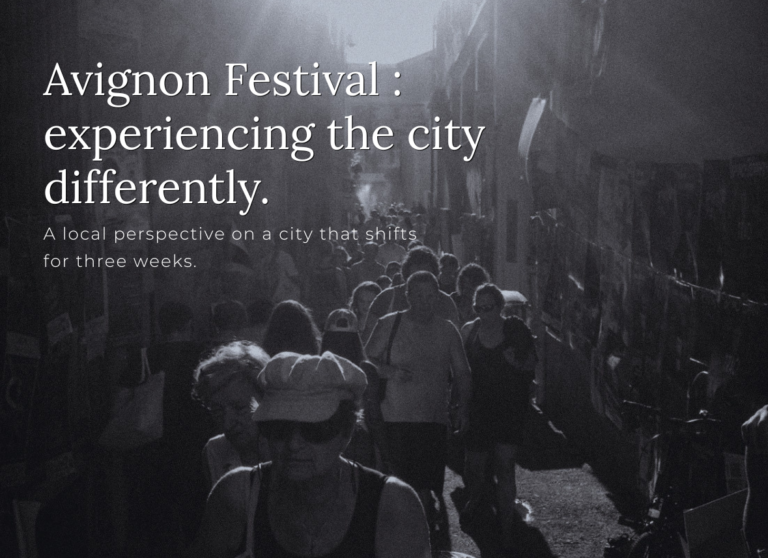crowded avignon street during festival 2026 black and white local perspective city atmosphere