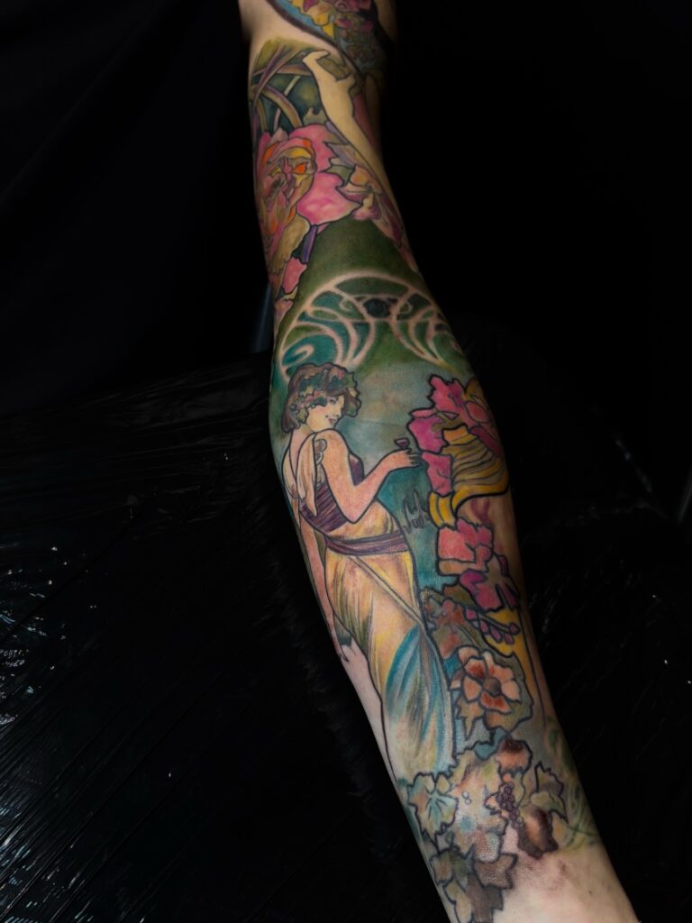 Feminine figure in the spirit of Mucha — full arm colour, available in London