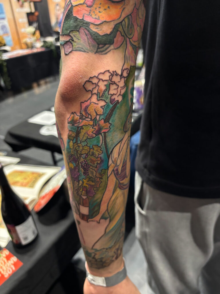 Full arm tattoo in colour inspired by Mucha, worked on during the Marseille tattoo convention, Tamara Chaudesaigues