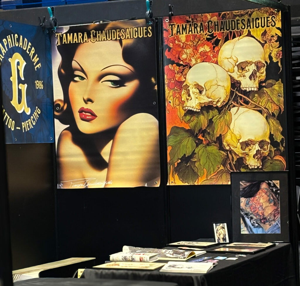 Tamara Chaudesaigues and Graphicaderme stand at the Marseille tattoo convention, original illustrations displayed