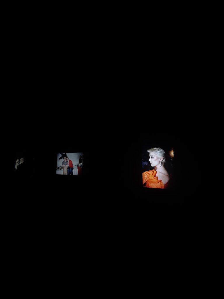Photo screens illuminated in a dark room at the David Armstrong exhibition at LUMA Arles