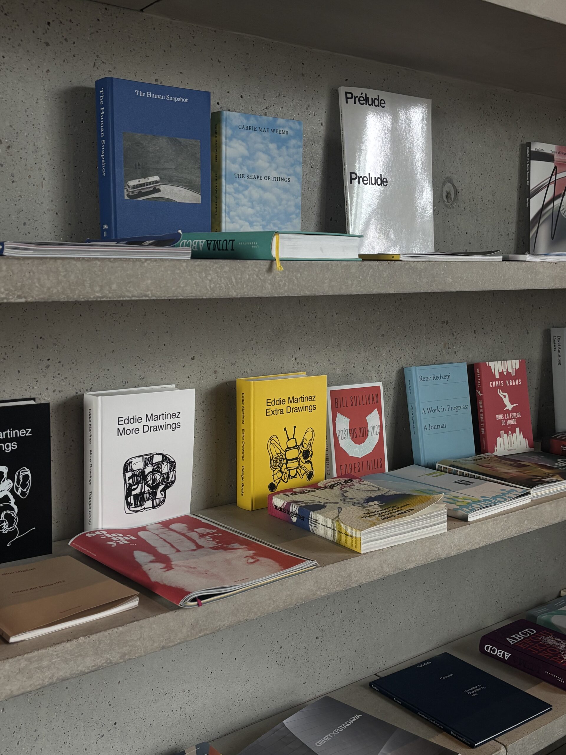 Art and photography books on the Drum Café’s concrete shelves