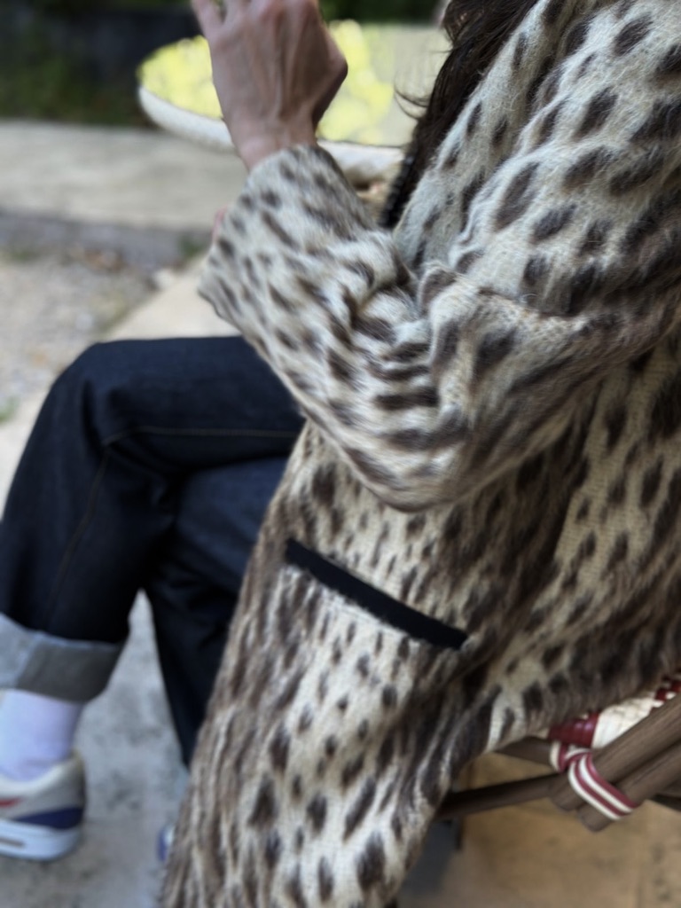 Detail of the Forte leopard coat worn with Saint Laurent jeans