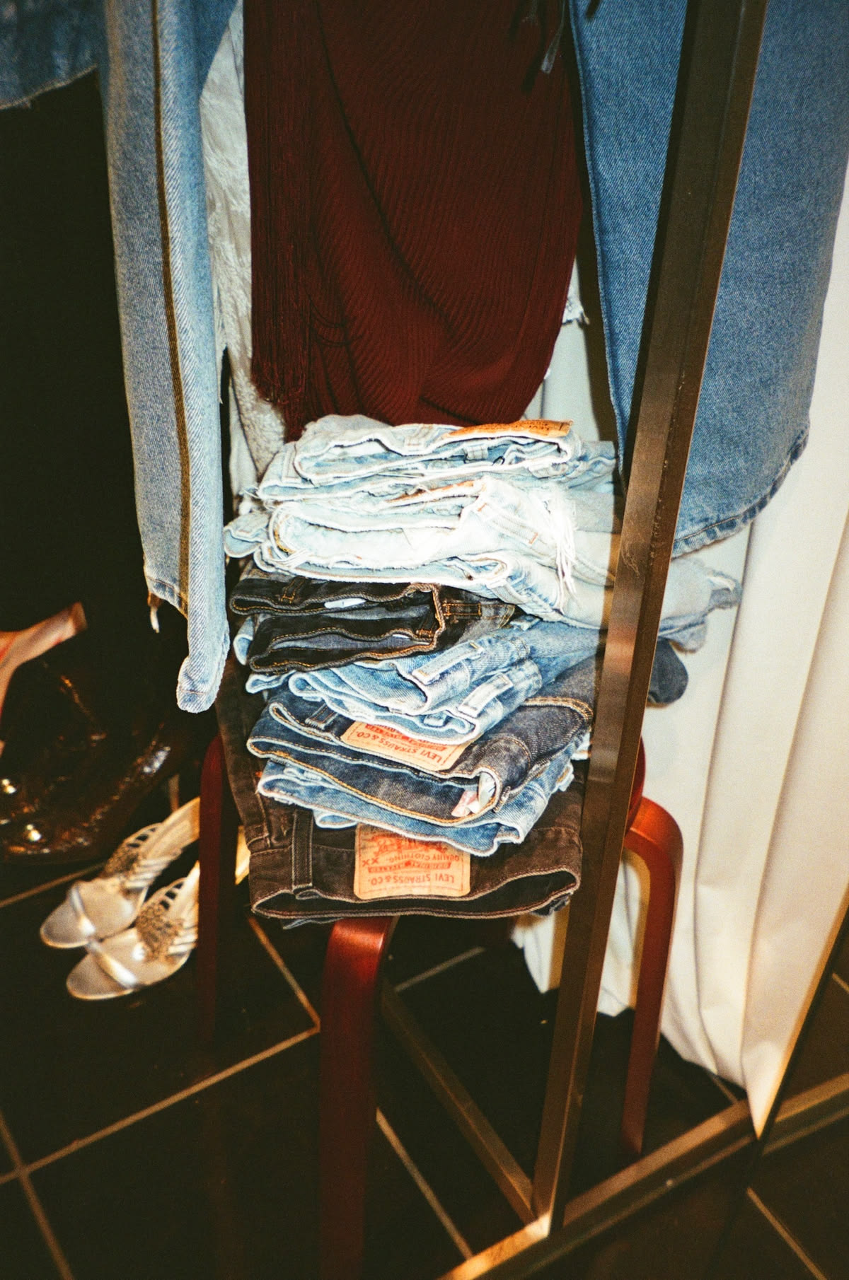 A stack of folded jeans during a wardrobe clear-out