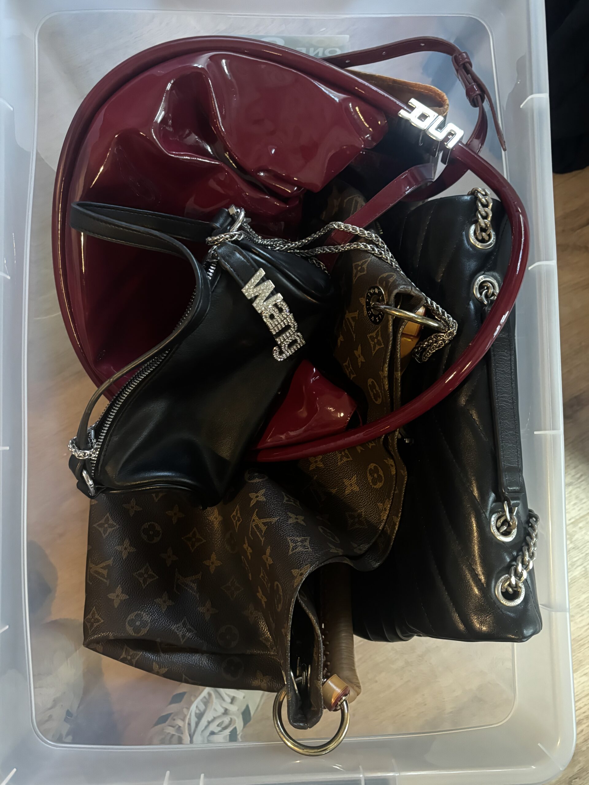 A box of handbags gathered together during the house move
